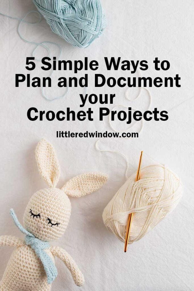 amigurumi white bunny ball of white yarn with orange crochet hook in it and ball of light blue yarn on a white background