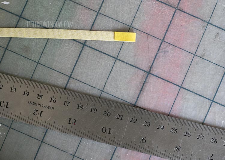 yellow faux leather strip folded over by three quarters of an inch