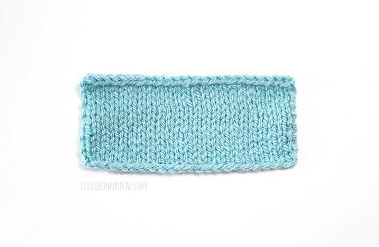 light blue rectangle knitting swatch on a white background showing longtail cast on method