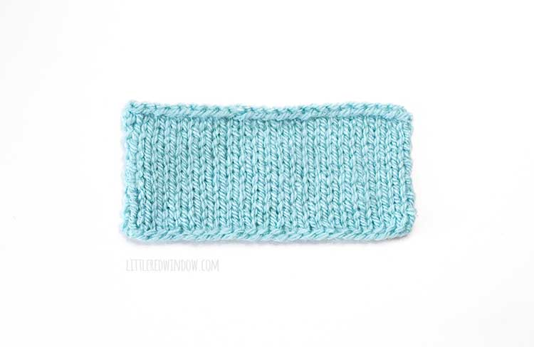 light blue rectangle knitting swatch on a white background showing German twisted cast on method