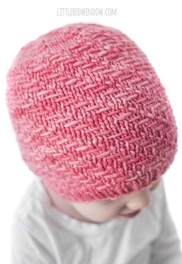 closeup of diagonal weave stitch on a bubblegum pink hat