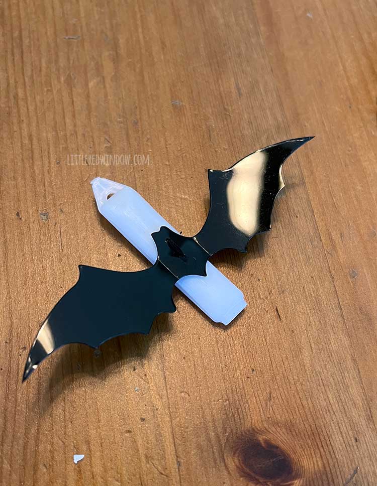 bat shape attached to blank barette with needle and thread