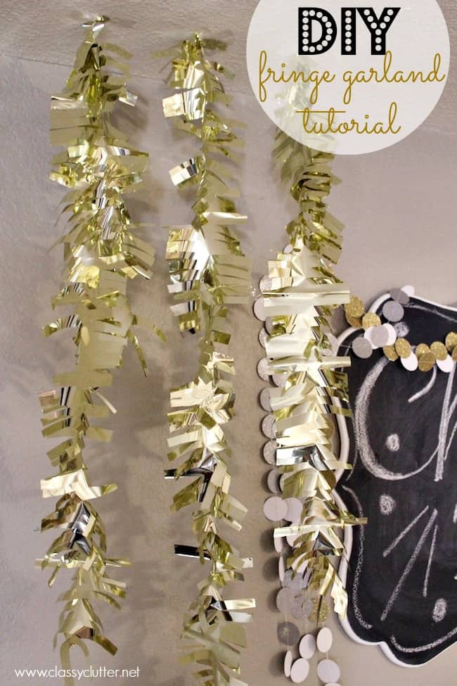 gold fringe garland hanging on a wall