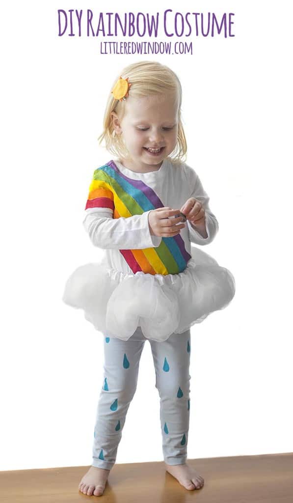 DIY Rainbow Costume for Kids! Get instructions to make this adorable costume including rainbow shirt, cloud tutu, raindrop leggins and sun hair clip!