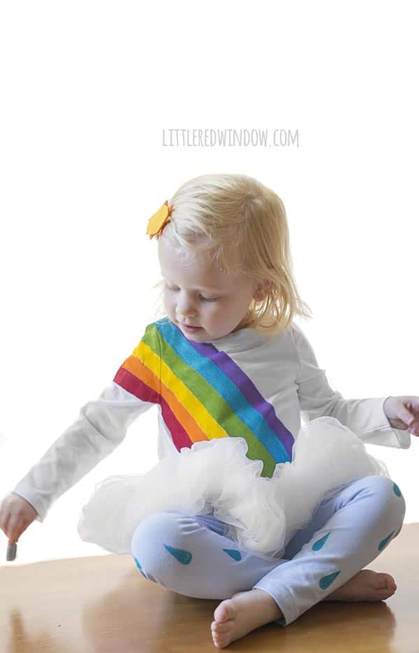 DIY Rainbow Costume for Kids! Get instructions to make this adorable costume including rainbow shirt, cloud tutu, raindrop leggins and sun hair clip!