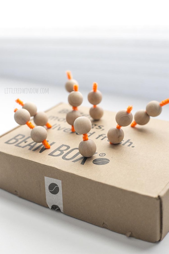 Put your wooden beads on short lengths of pipe cleaner stuck into an old cardboard box to make them easy to paint!