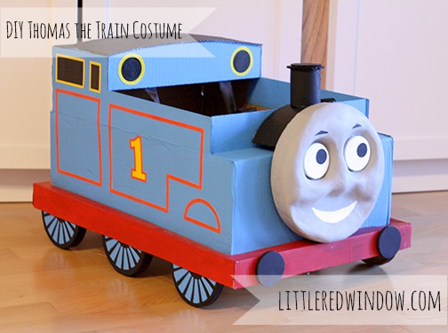 Finished cardboard box Thomas the train costume on the floor!