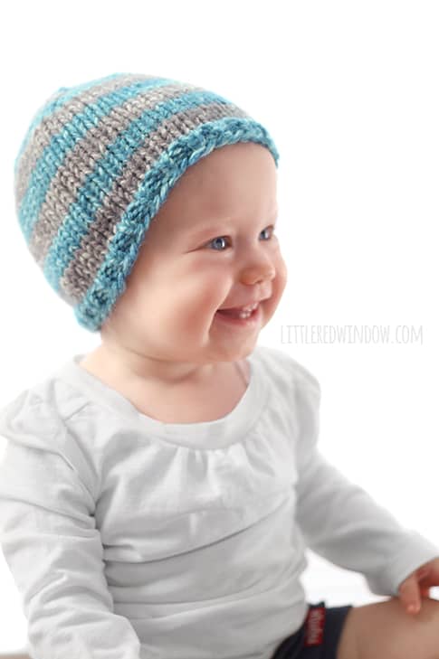 This cute blue and gray striped hat is one easy way to customize the adorable Do-Gooder baby hat knitting pattern, a free pattern that you can knit for charity!