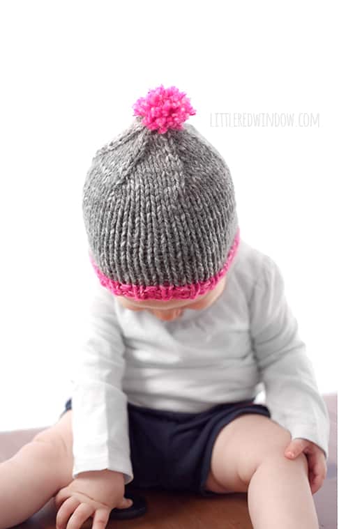 The Do-Gooder free baby hat knitting pattern is super easy to customize, it looks adorable with a contrast brim and bright pom pom on top!