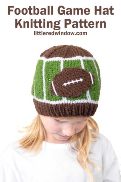 A child wearing a football hat—a knitted hat designed to resemble a football field with a football on top. Text above reads: