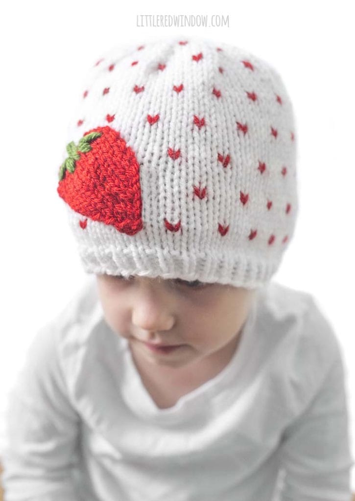 It's easy to embroider the leaves on top of the easy knit strawberry applique on the Fresh Strawberry Hat knitting pattern!