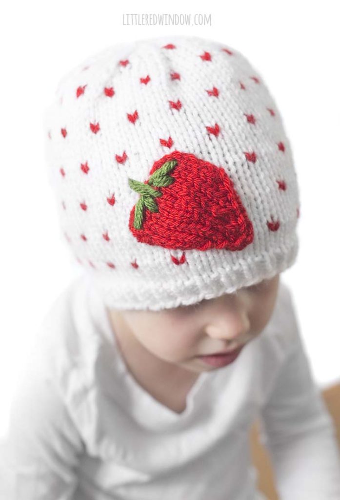 The Fresh Strawberry Hat knitting pattern has a cute little applique strawberry on the front!