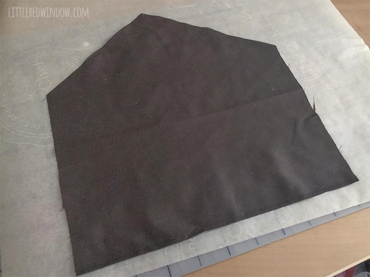 piece of brown fabric in the shape of a gingerbread house