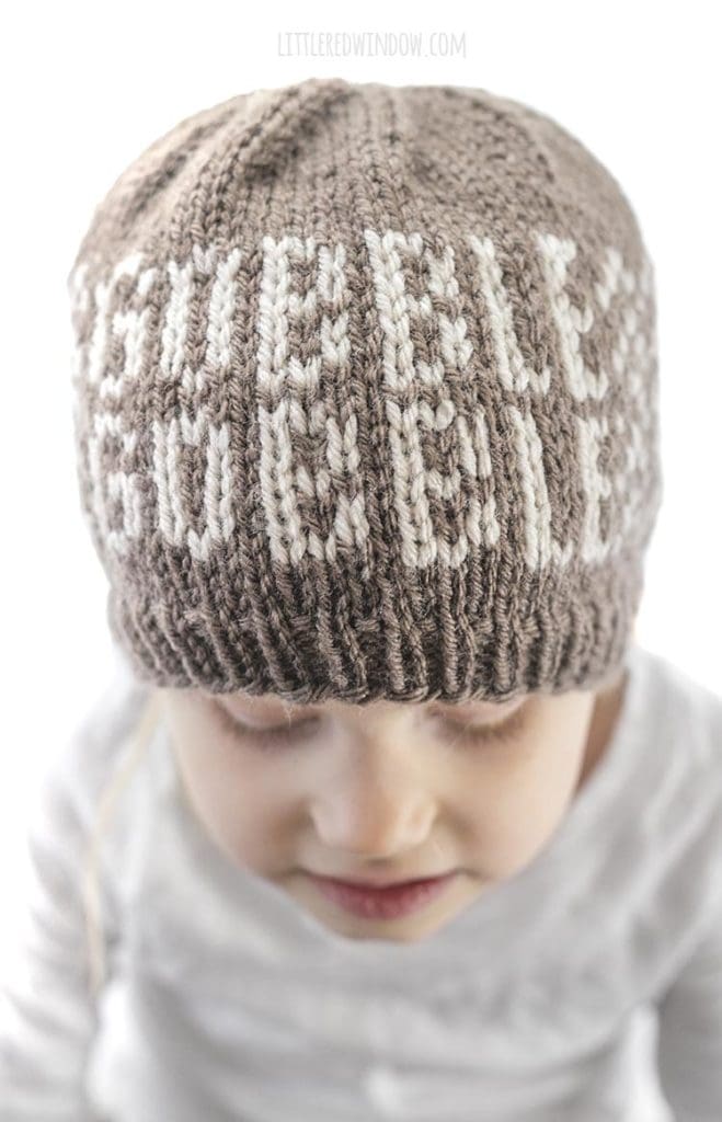 closeup of gobble gobble design on front of brown knit hat