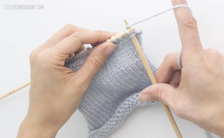 To bind of knit stitches, knit another stitch and then lift it up and over the first stitch on the right knitting needle