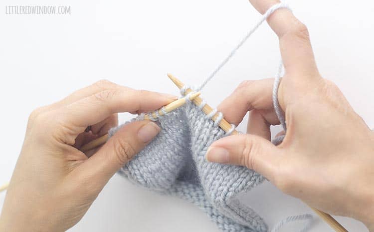 To complete the sk2p stitch, use the tip of the left knitting needle to lift the slipped stitch over the k2tog and off the right knitting needle