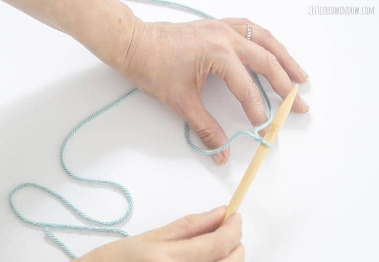 To start a long tail cast on, put your thumb and pointer between the two yarn tails