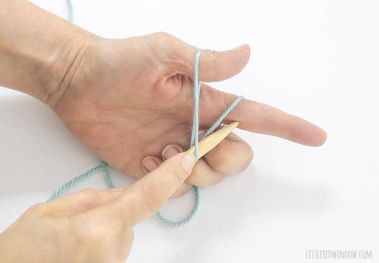 To form the stitch for a long tail cast on, use the needle to sweep and grab the yarn from your pointer finger