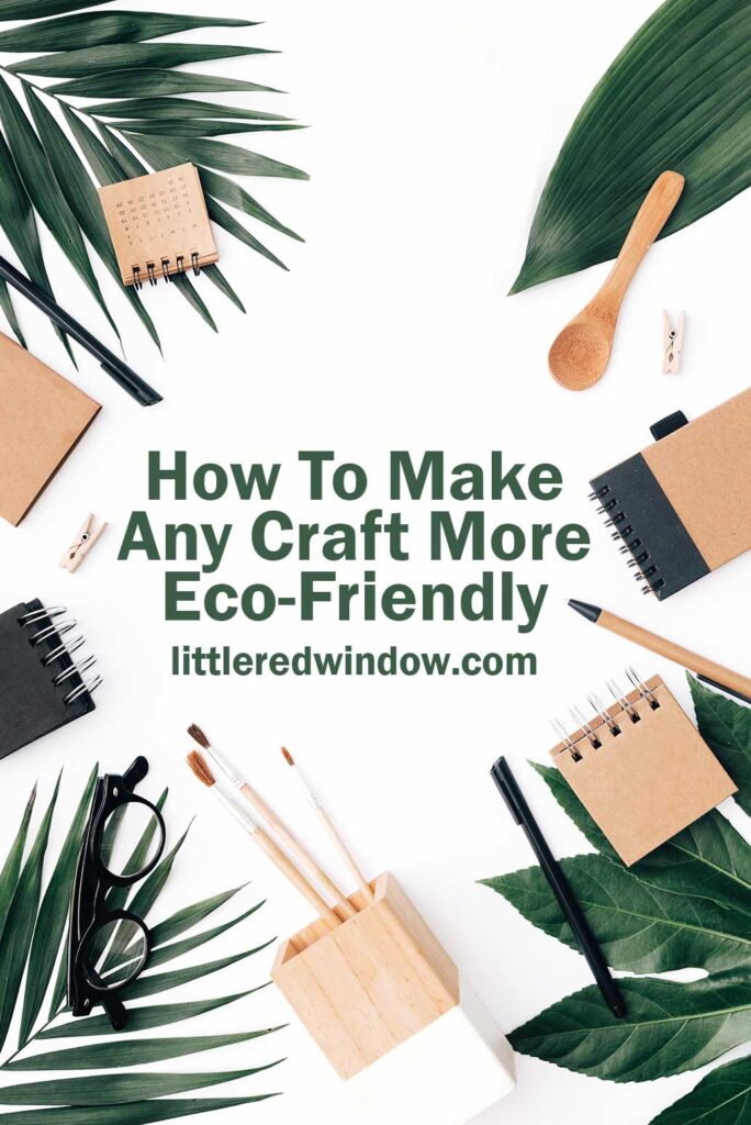 natural colored craft supplies arranged in a circle with large green leaves on a white background