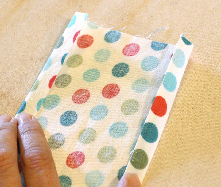 strap rectangle right side down with folded over=edges by 1/2 inch