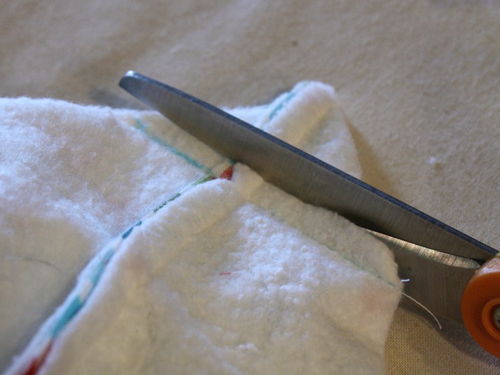 scissors trimming a box corner