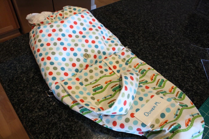 picture of a person Turning tote back right side out with the lining outside