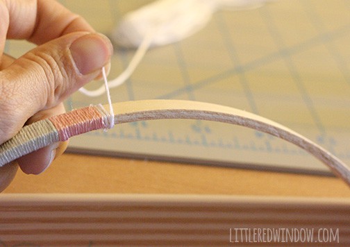 Hand wrapping embroidery thread around the outer hoop