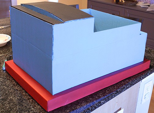 Cardboard box train shape with this red base box added to the bottom