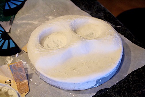 Paper mache train face with smoothed spackle on top