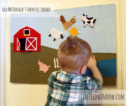 Little boy playing with Old McDonald's Farm Felt Board