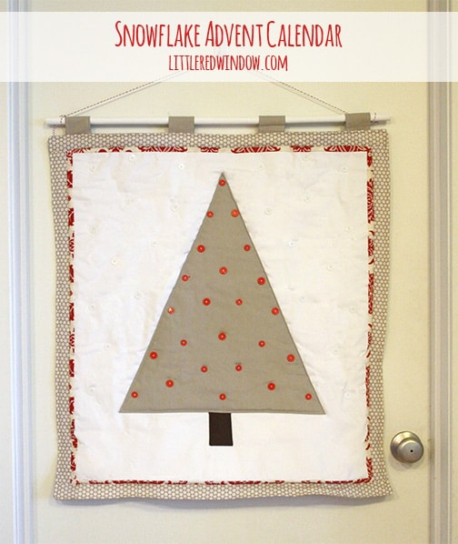 Quilted tan tree shape on a white background with red trim and red buttons