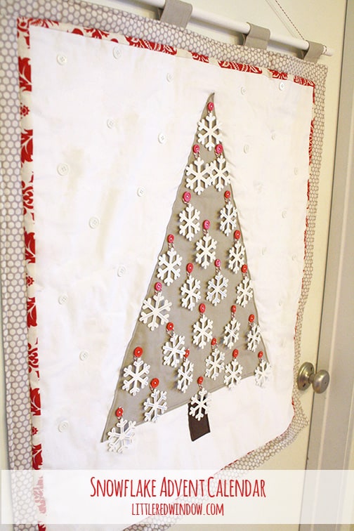 Quilted snowflake advent calendar with all of the snowflake shapes on the tree