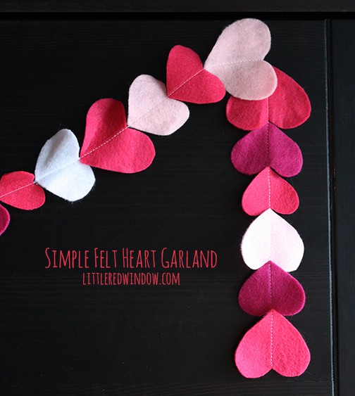 Pink and white heart garland on a black background
