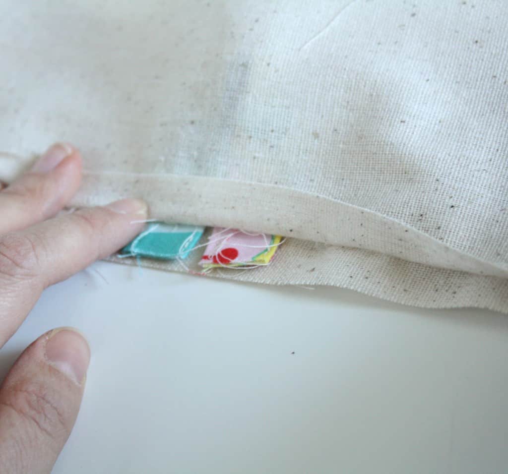 Travel Drawstring Laundry Bag Tutorial | littleredwindow.com | Make an pretty and useful travel laundry bag with cute stenciled detail with this great tutorial!