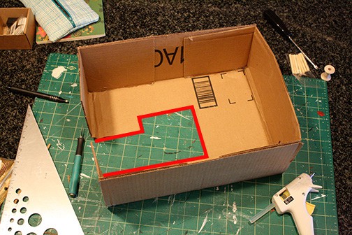 sewing machine shape with red line added to show where to add cardboard shapes for sides