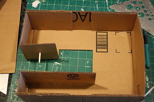 DIY Cardboard Box Play Sewing Machine | littleredwindow.com | Great tutorial for an adorable play sewing machine made out of an old box!