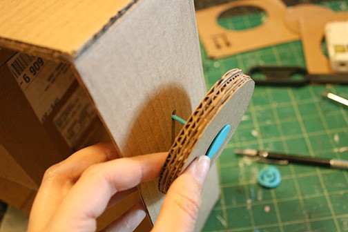 DIY Cardboard Box Play Sewing Machine | littleredwindow.com | Great tutorial for an adorable play sewing machine made out of an old box!
