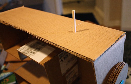 dowel attached to top of sewing machine for spool holder