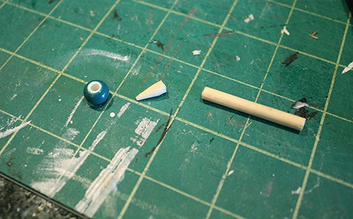 front of sewing machine with buttons, sliders and turning knob