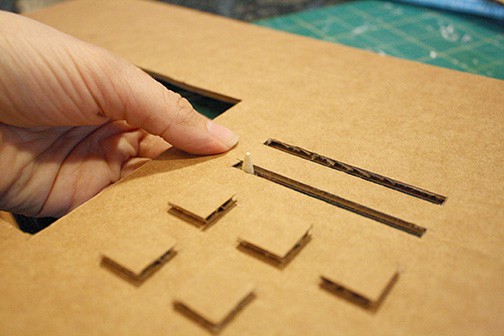 DIY Cardboard Box Play Sewing Machine | littleredwindow.com | Great tutorial for an adorable play sewing machine made out of an old box!