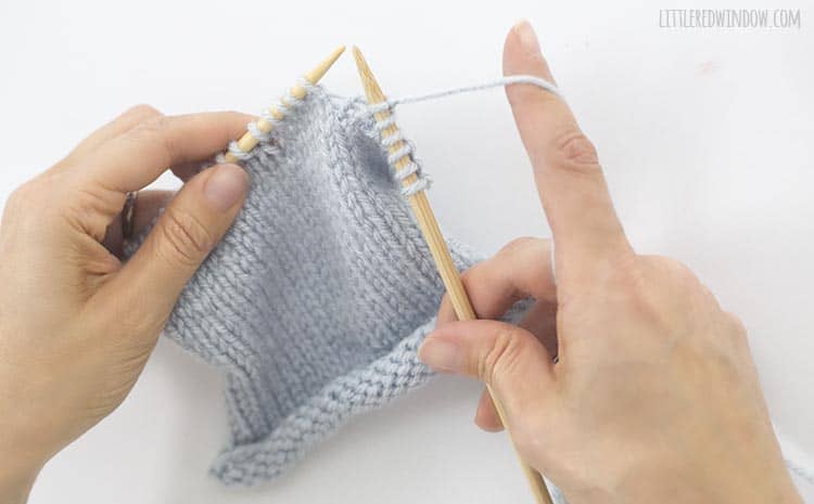 Drop the original stitch from the left knitting needle