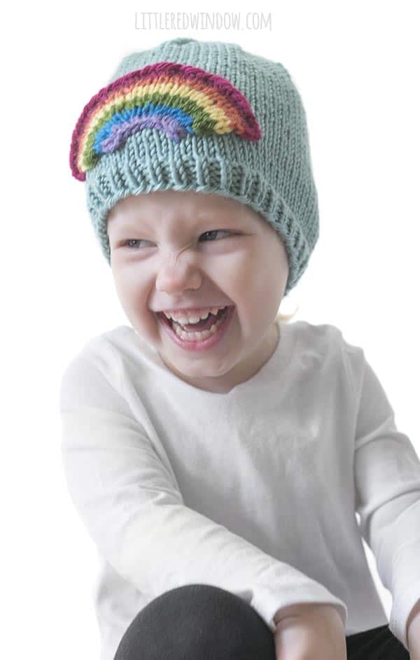Knit this adorable and colorful Little Rainbow Hat knitting pattern for your little one!