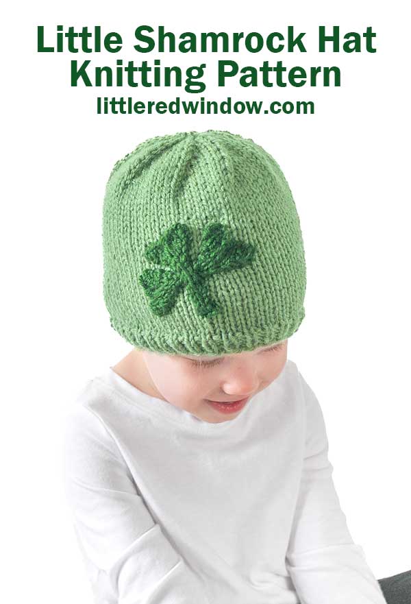 A child in a green shamrock hat, smiling downwards. Text above reads