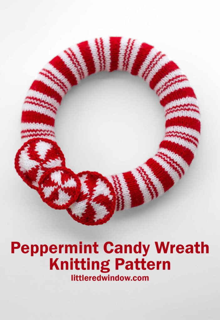 A knitted wreath with red and white peppermint candy stripes, featuring three round pepperming candies. Text reads, 