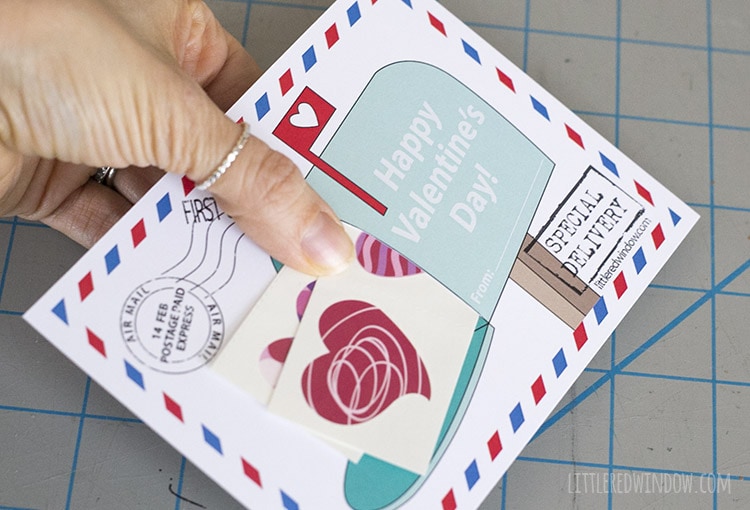 Insert the tattoos or stickers through the opening in the mailbox Valentine!