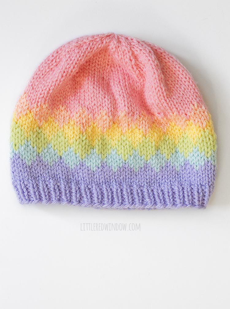 Overhead view of Knit hat with six rainbow colors in a diamond pattern