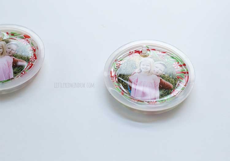 closeup of an ornament mold with clear resin poured on top of the sprinkles and photos