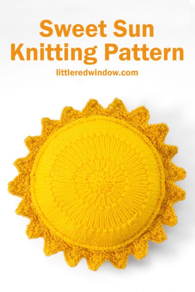 bright yellow knit sun with mustard yellow sun rays around the outside on a white background from above