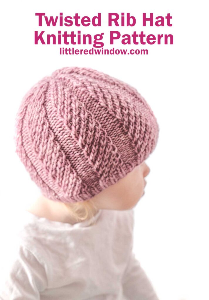 Child in a light-colored shirt wearing a pink Twisted Rib Hat. Text above reads