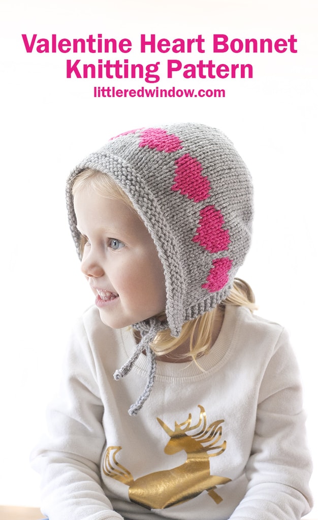 This cute Valentine Heart Bonnet knitting pattern is a quick easy knit for your baby or toddler with bright row of colorwork hearts across the top!